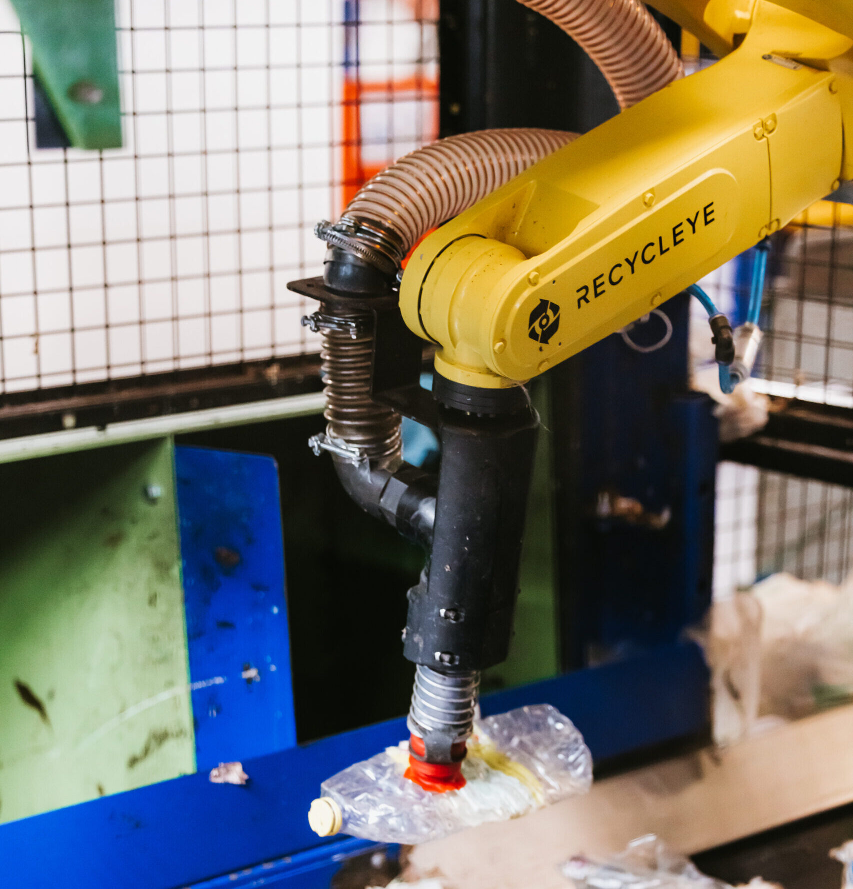 A robot sorting a plastic bottle to enable it to be recyclyed